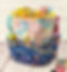 Caddy pop up container with a bucket handle in bright cotton fabrics filled with notions. Click to go to the product page for more information.