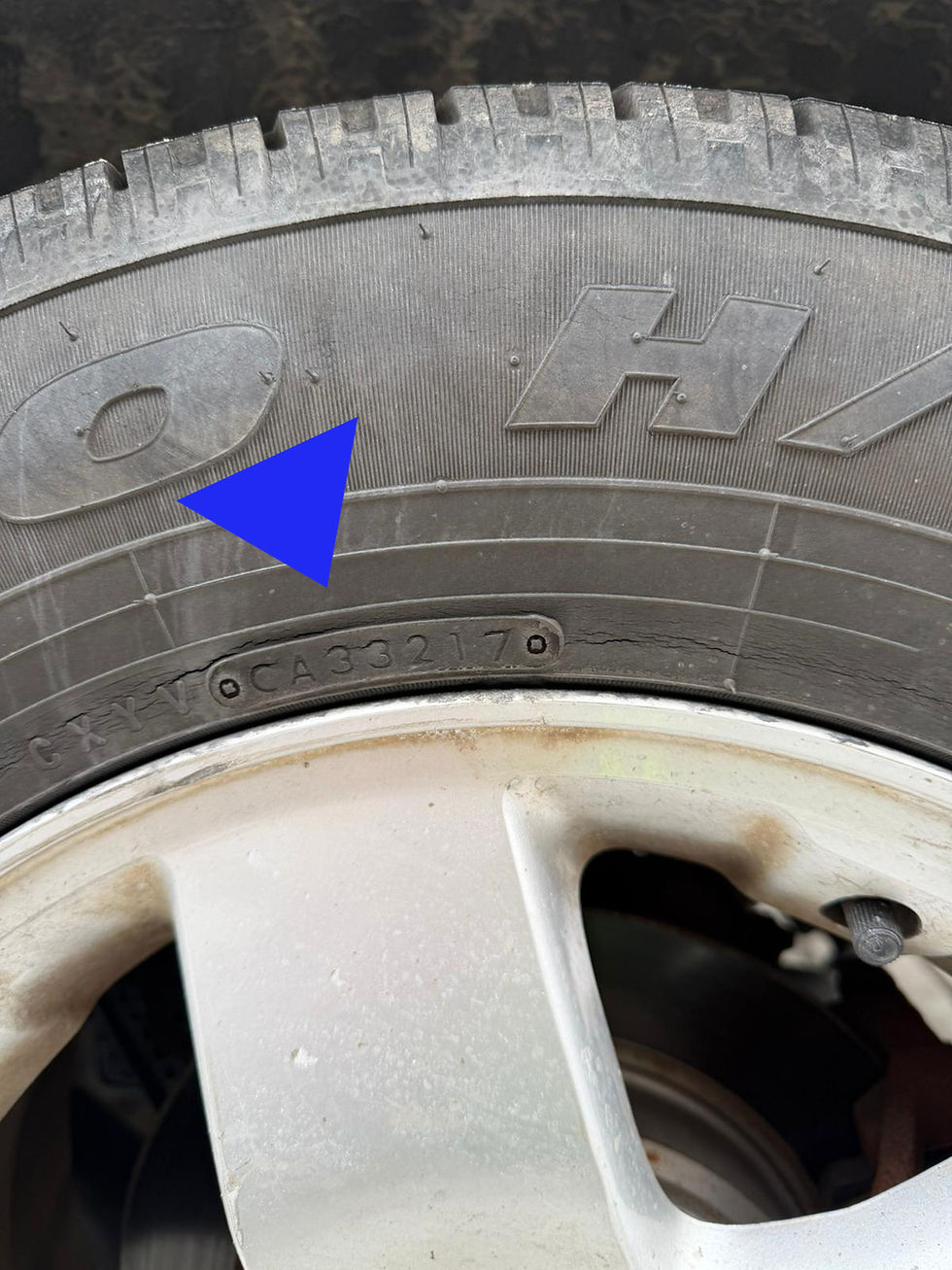 Tire manufactured in 2017 with visible wear, indicating it may be expired and in need of replacement for safety.