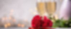 Valentines day table setting red roses and champagne glasses on concrete background_edite