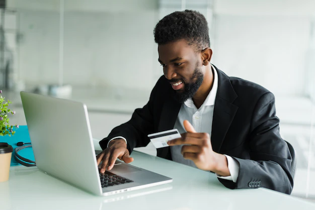 internet-banking-sales-successful-african-businessman-sitting-laptop-holding-credit-card-h
