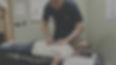 Bryan Fall gives spinal care to young lady.