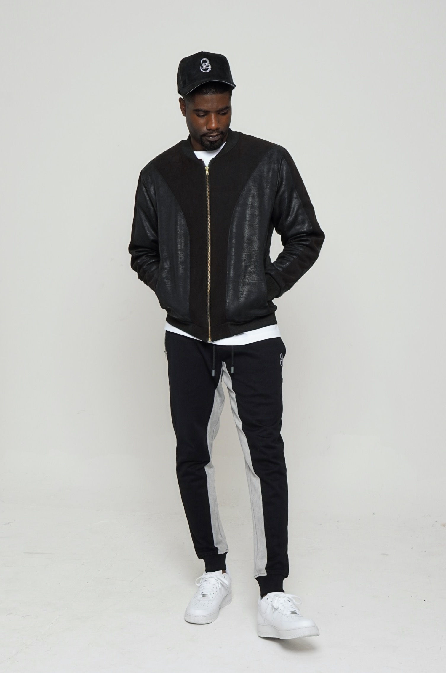 model wearing bomber and black joggers