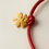Miniaturbild: Red Luck – Rotes Armband mit vergoldetem Glücksanhänger