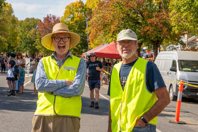 Two volunteers laughing towards camera at Golden Horseshoes Festival