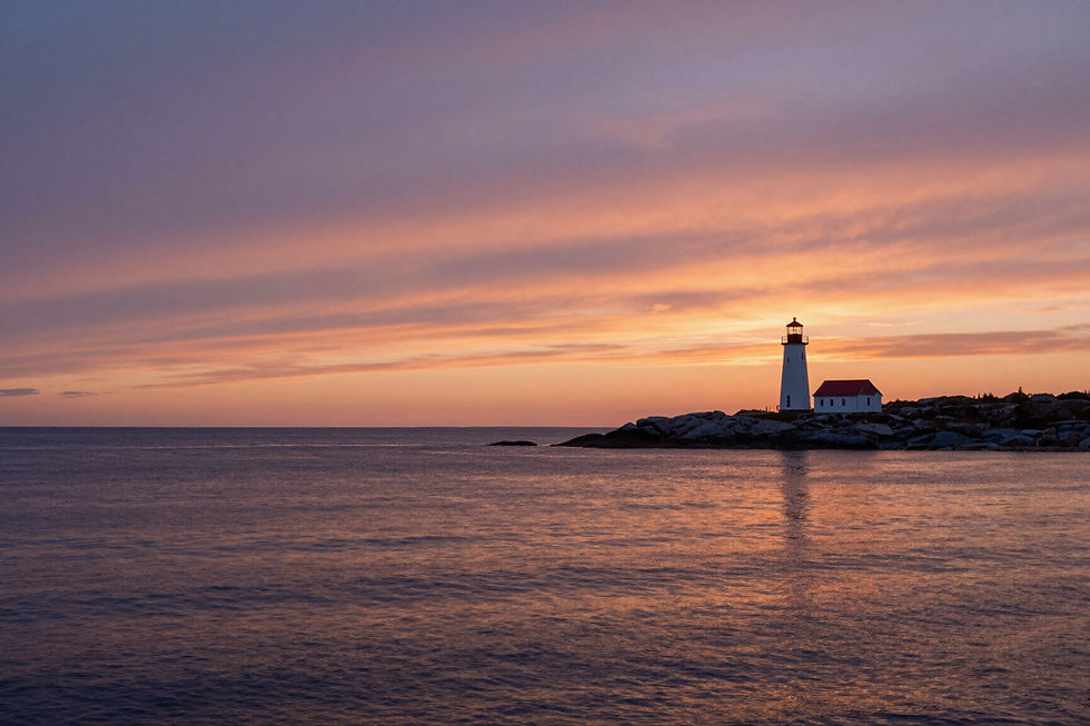 Peggy's Cove lighthouse at golden hour during a Halifax sightseeing tour