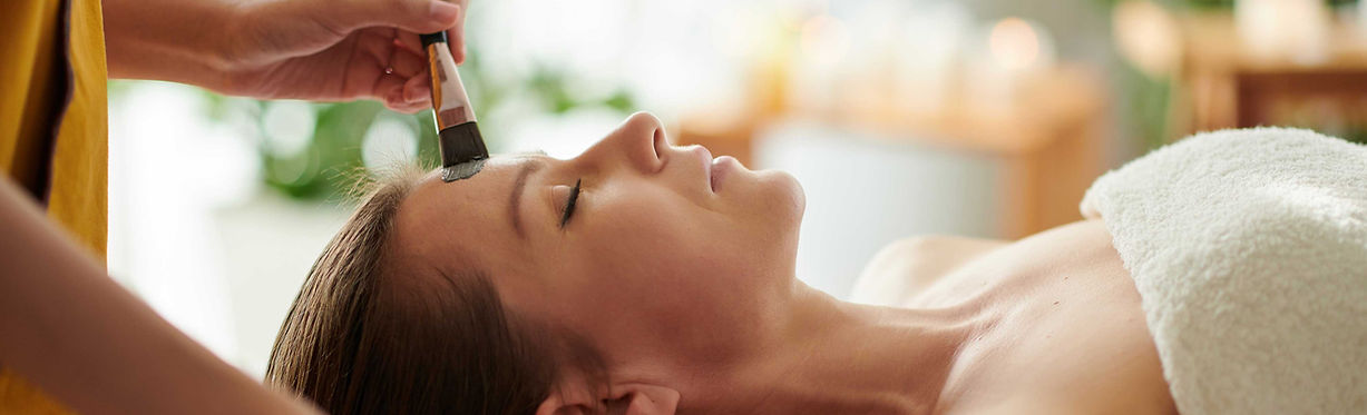 Woman receiving a facial treatment