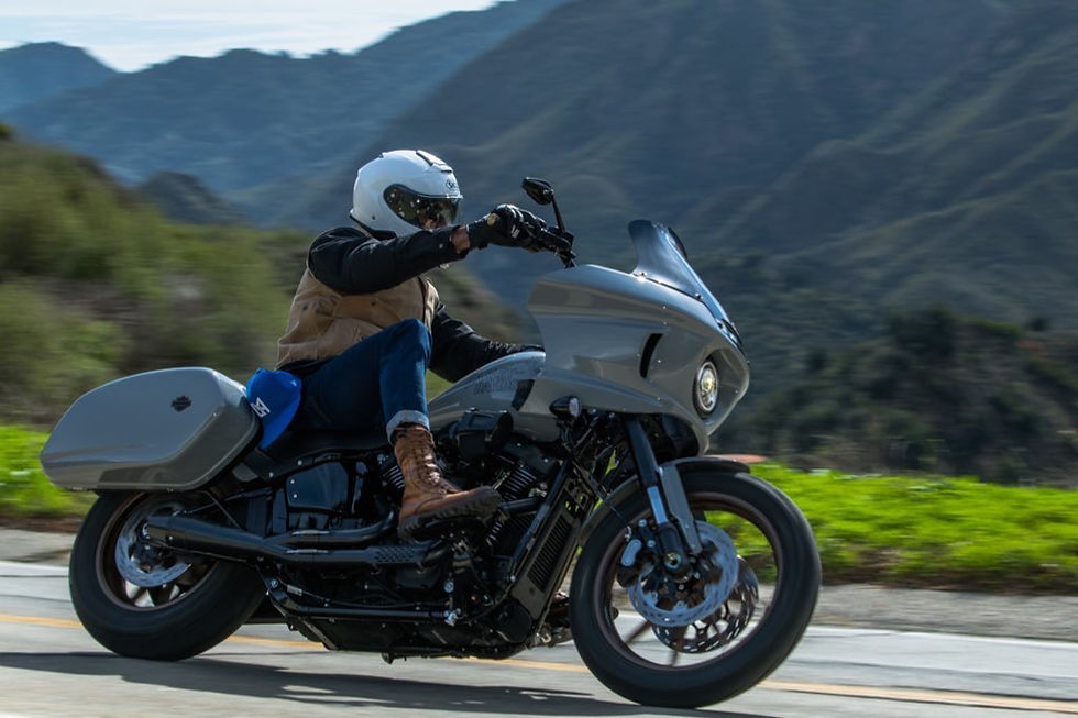 Jaime Camil riding his 2024 Harley-Davidson Low Rider ST on Mulholland Drive, captured by Victory Jon. The scenic backdrop and winding road highlight the bike’s sleek design and West Coast style.