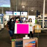 carolina sunshine volunteers with a poster board