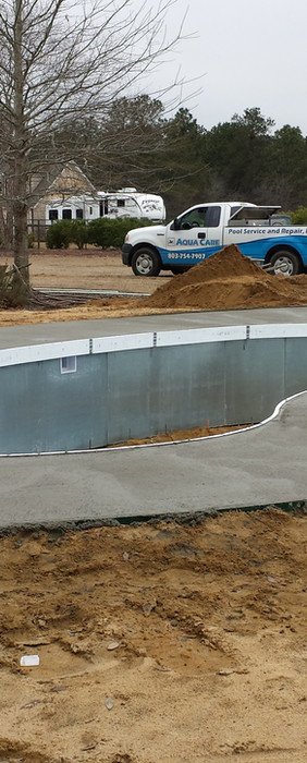 New pool installed with deep end an sidewalk