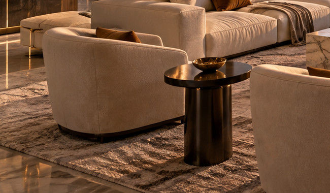 Close-up crop of a cream chair, upholstery texture and warm color relationships in the penthouse concept — residential interior design in Miami, FL