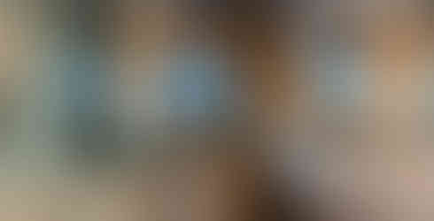 Luxury Modern Wood and White Bathroom Remodel with Medium Stained Oak Wood Floor Planks Tiles; to the right hand side you can see a Beautiful Double Shelving Top 10 Inches Thick Solid White Quartz Stone Countertop with Built-In Double Sinks and Wall Mounted Double Stainless Steel Faucets separated by an 8 inches Height Hollow Space from the Bottom 1.5 Inches Thick Solid White Quartz Stone Countertop is attached to a Bottom 10" Height Medium Stained Oak Wood Drawers Vanity Cabinetry has 24 inches Long Stainless Steel Pulls; up you can find 3 Ceiling Levels each with Different Materials: White Painted Ceiling - Medium Stained Oak Wood Veneered Ceiling - Dark Brown Oil Stained Painted Ceiling; to the left hand side there is a Rectangled Shape Marble Stone Floor and Far Left Wall enclosed in clear glass with a Single Entry Door Walk-In Shower; all 3 Ceilings have Built-In Warm Recessed Can Lighting System; centered back wall has a Floor Standing White Bath-Tub and right behind it there is a Double Clear Glass Floor to Ceiling Window with a beautiful panoramic nature mountain trees and purple blue pink skies view.