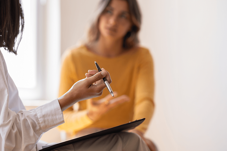Patient talking with a psychiatric provider during an evaluation.