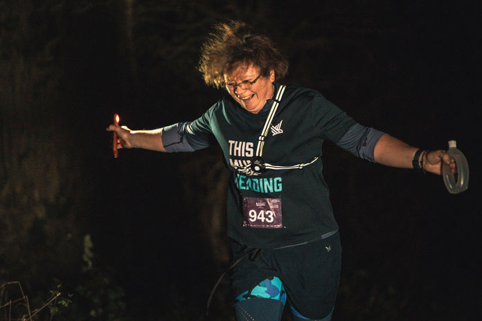 Happy British trail runner at the night Maverick Race in Oxfordshire.