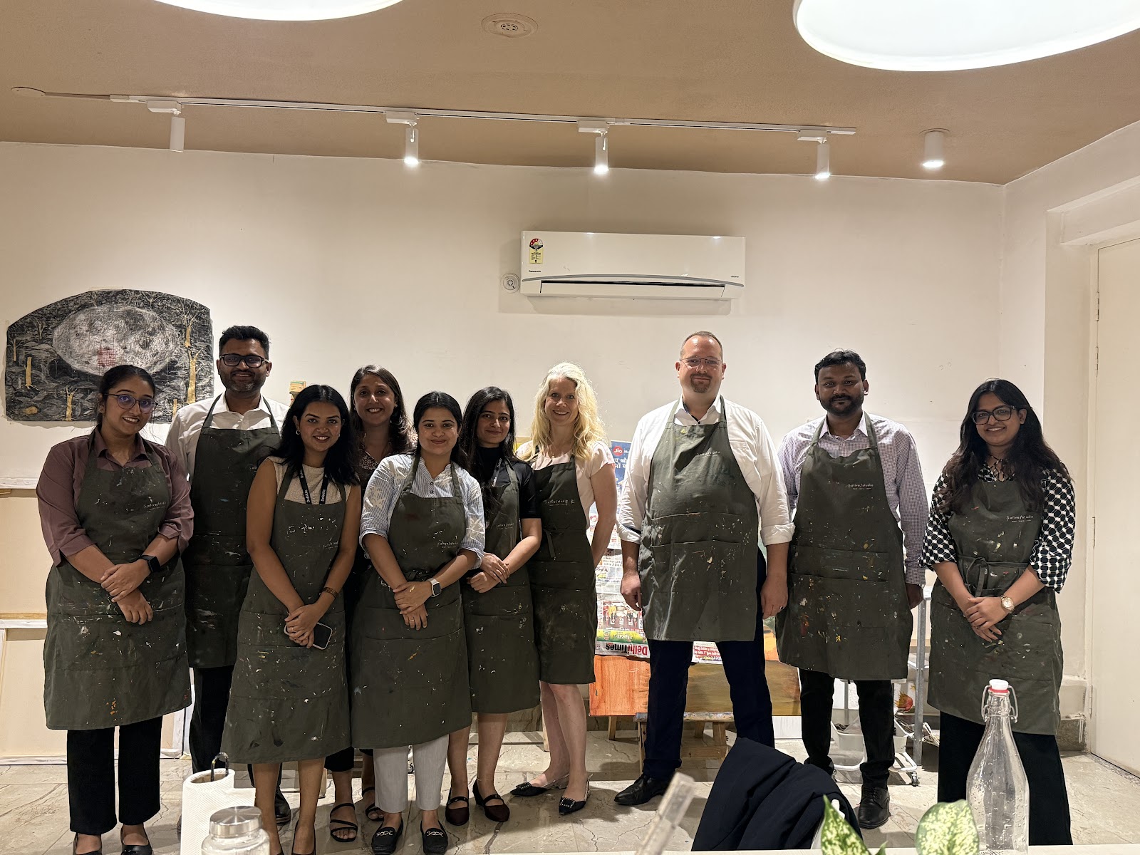A team in aprons after a workshop at Alive Studio