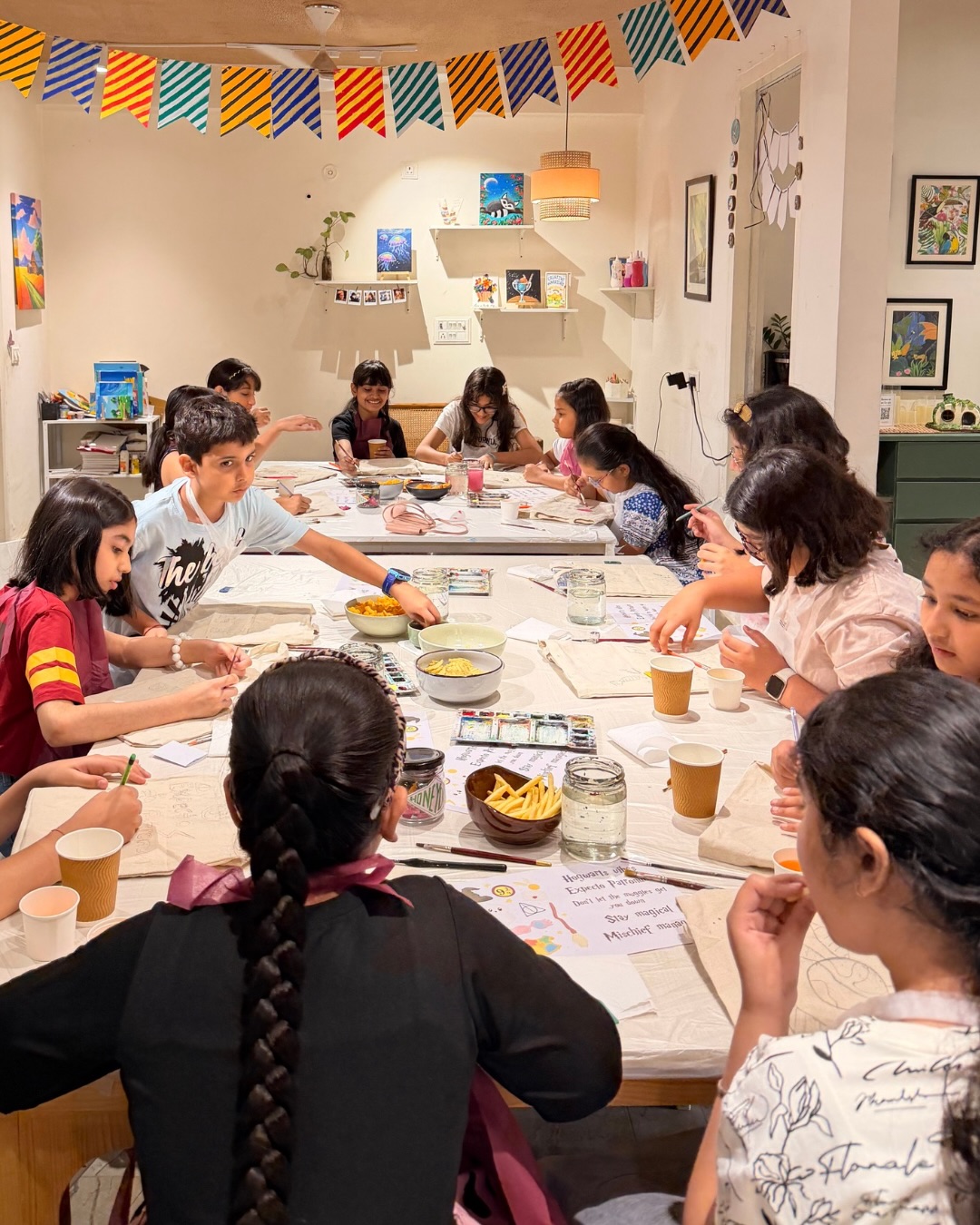 A full art-party table at Alive Studio