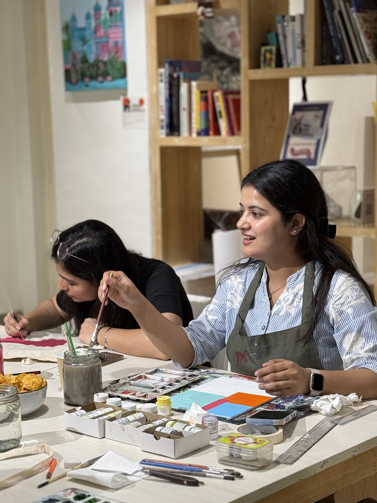 Laughing while painting at a team workshop