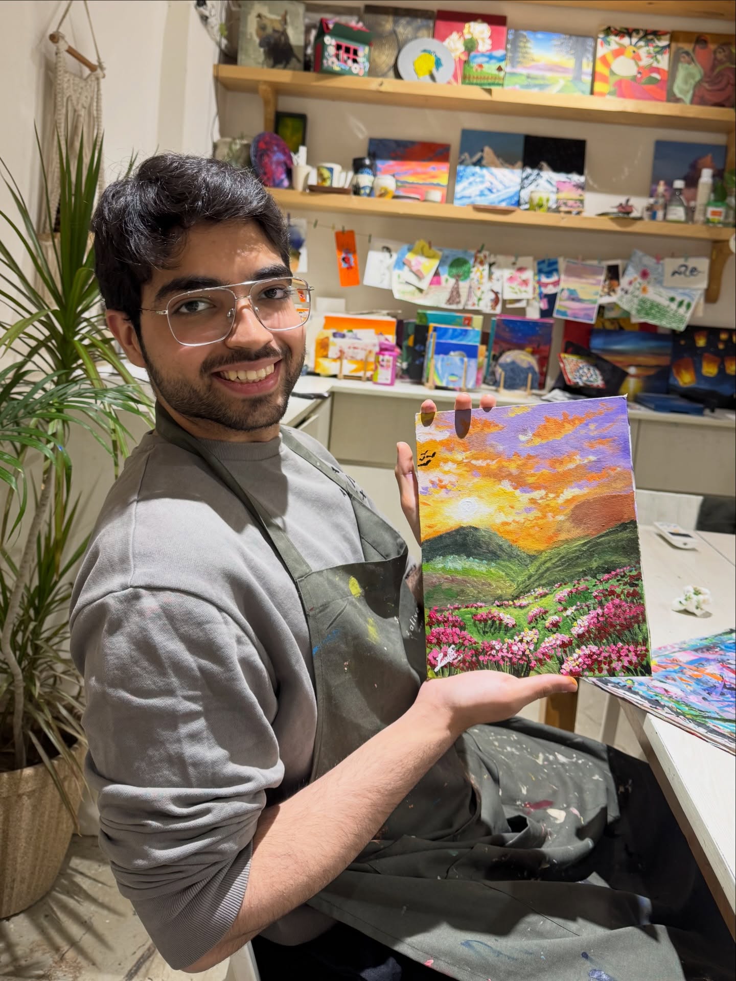 A guest with a detailed landscape painting