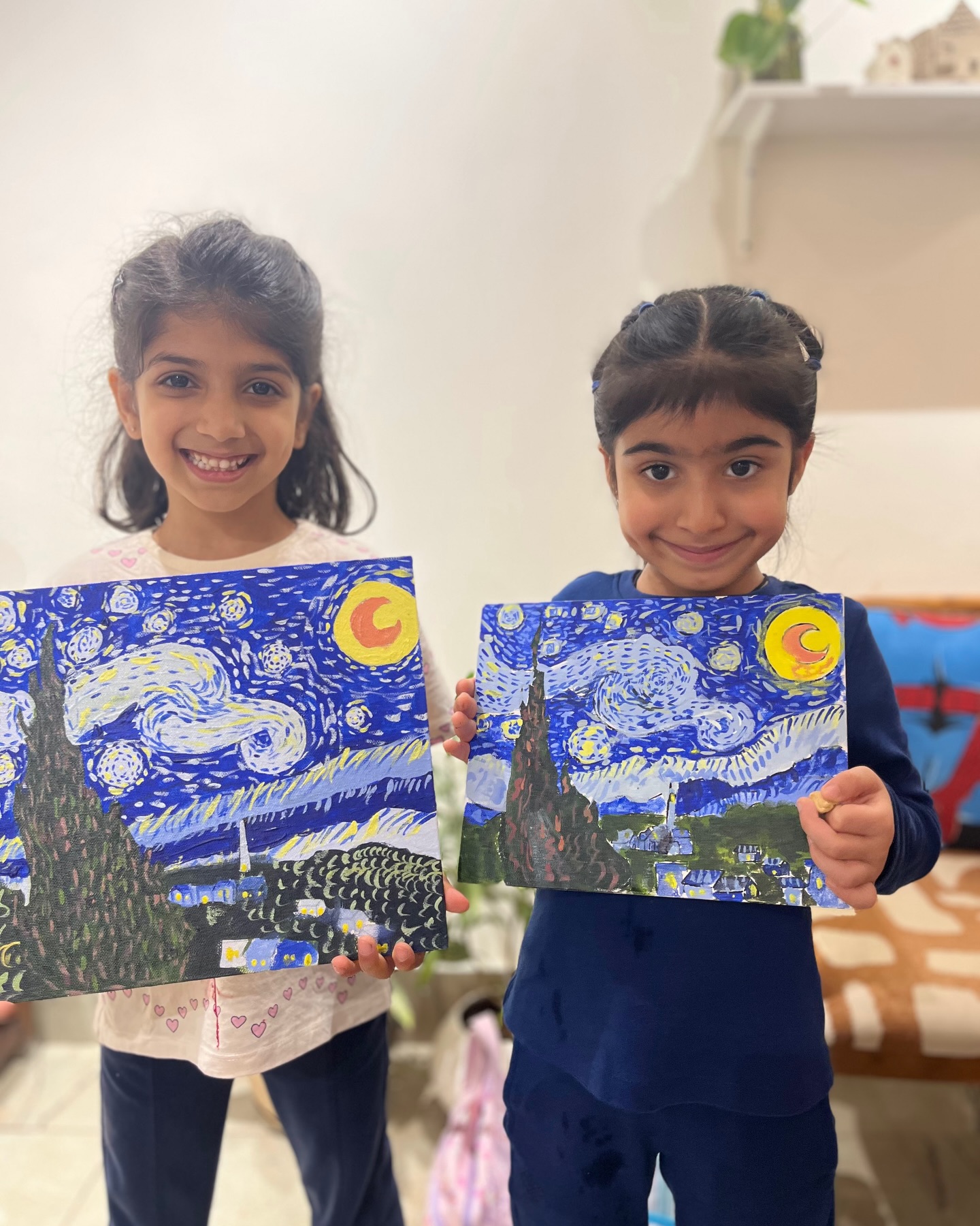 Young artists with Starry Night paintings
