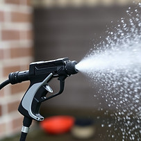 Power washer gun spraying water.jpg