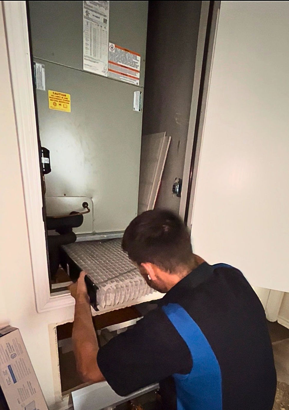 Daley Air technician installing an indoor air quality system in San Antonio, TX