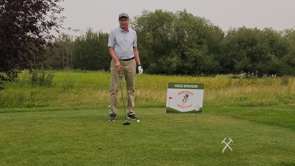 Ed Romijn at a golf hole sponsored by Homesteader Community League