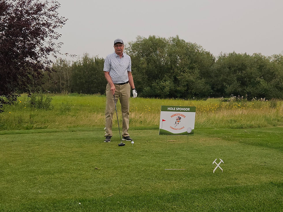 Ed Romijn at a golf hole sponsored by Homesteader Community League
