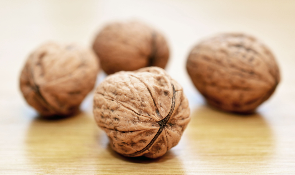 close up of 4 walnuts