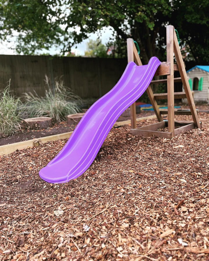 A purple slide in the garden