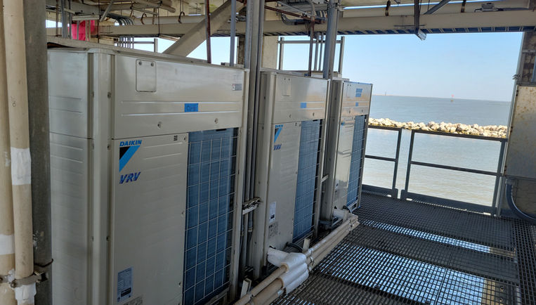 Three HVAC units sitting on a platform overlooking the Louisiana Delta.