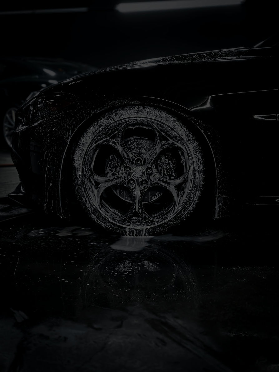 a close up of a car tire on a wet surface_edited.jpg