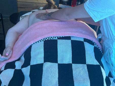 Student learning professional massage techniques during massage therapy training with Holistic Therapies Training Academy