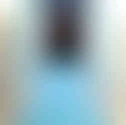 girl on a yoga mat in child pose