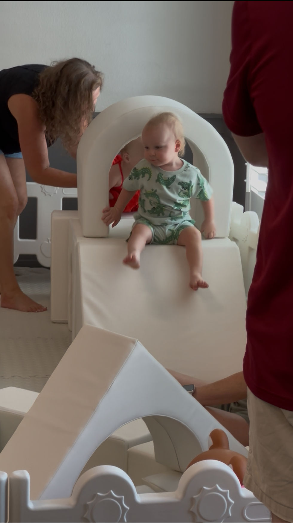 Eye-level view of colorful soft play tunnel and slide setup
