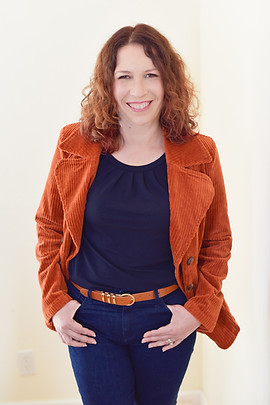 Myriam Martinez wearing blue clothing with orange jacket