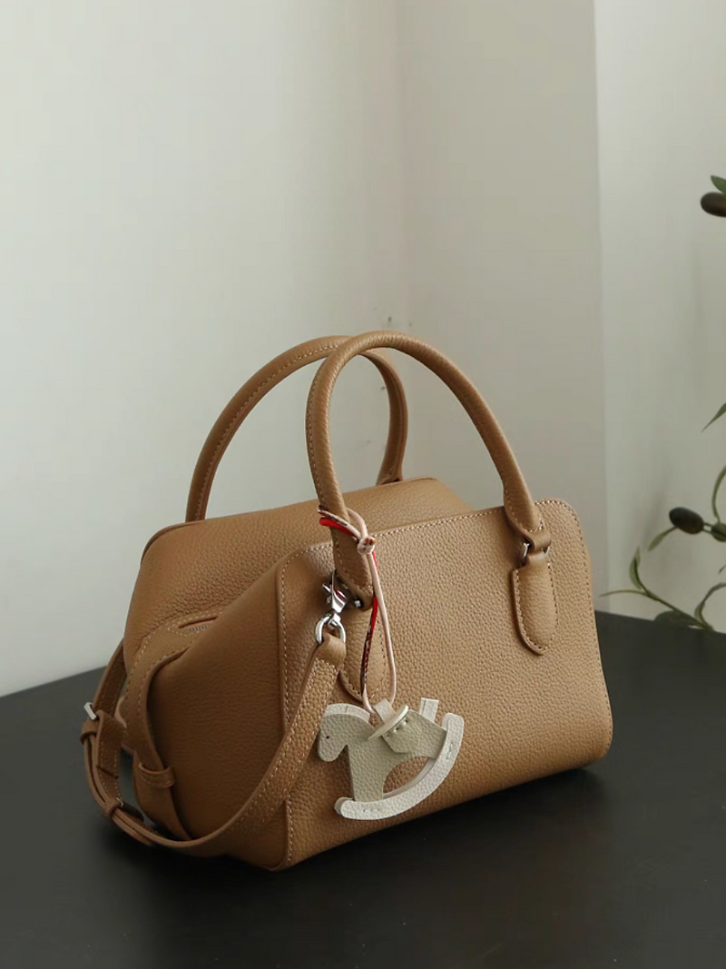 Toga embossed handle + crossbody bowling bag with pony charm 1