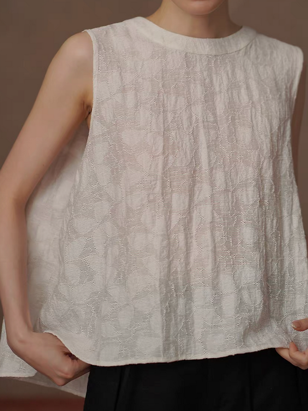 Ivory embossed peplum patterned lyocell poly vest