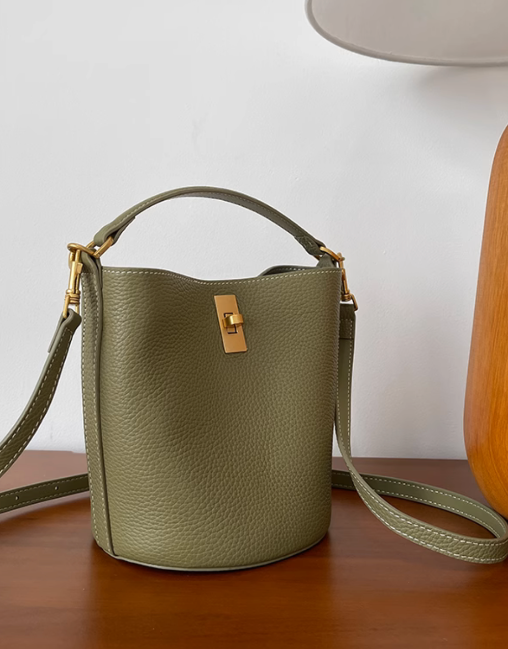 Toga embossed twisted buckle handle + crossbody bucket bag