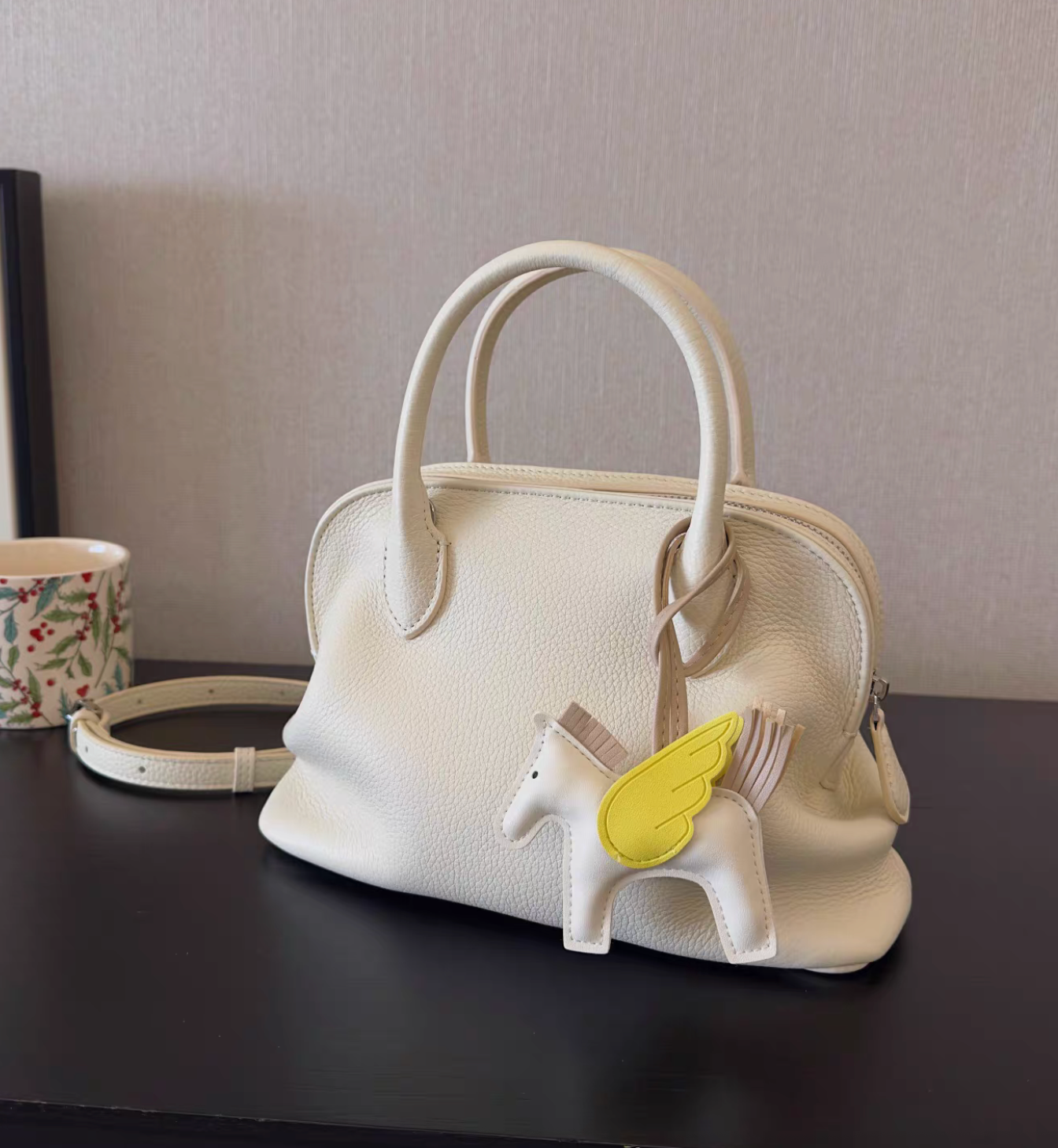 Ivory toga embossed calf leather handle + crossbody bowling bag