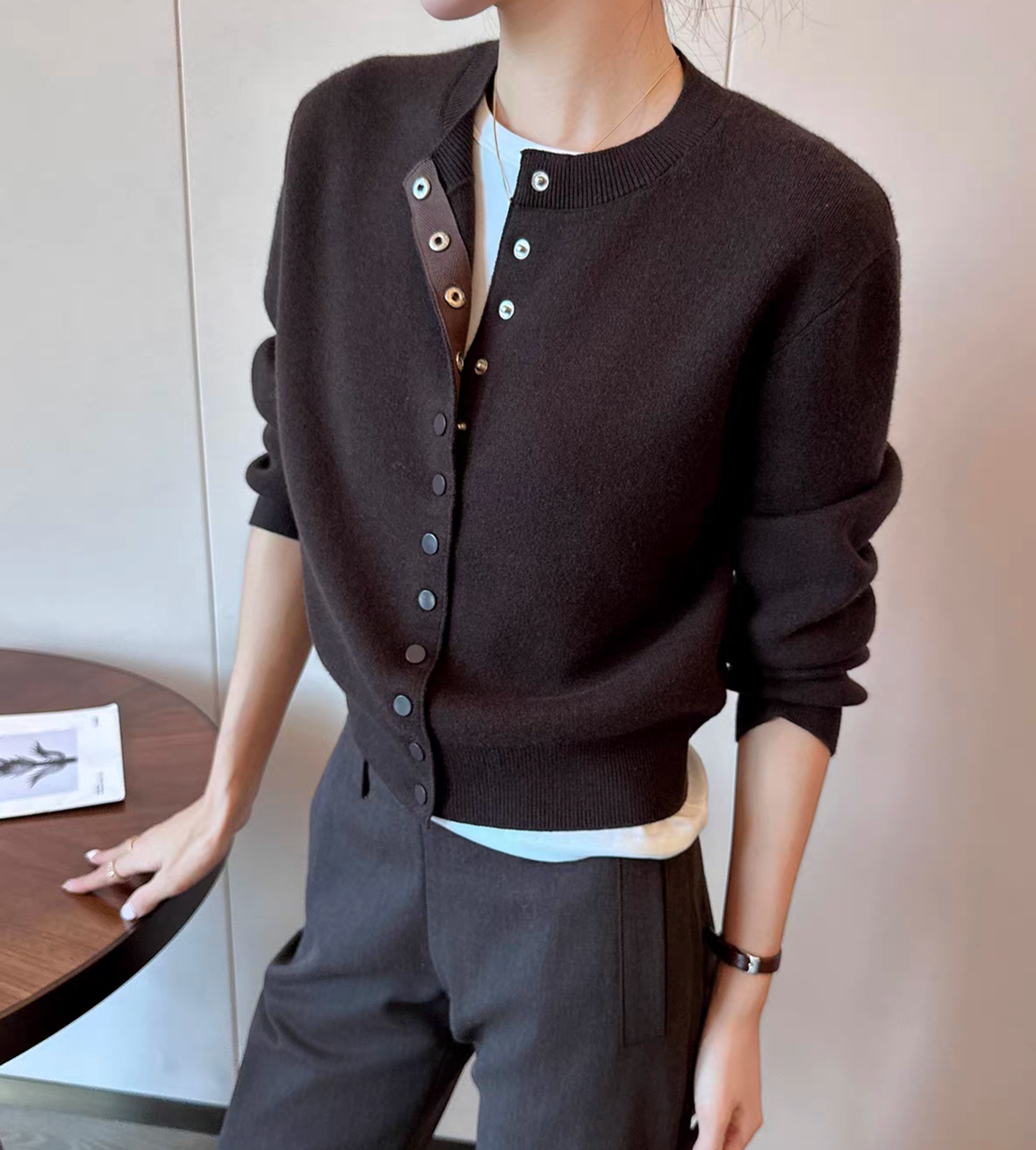Clasped buttoned crewneck knitted acrylic rayon cardigan