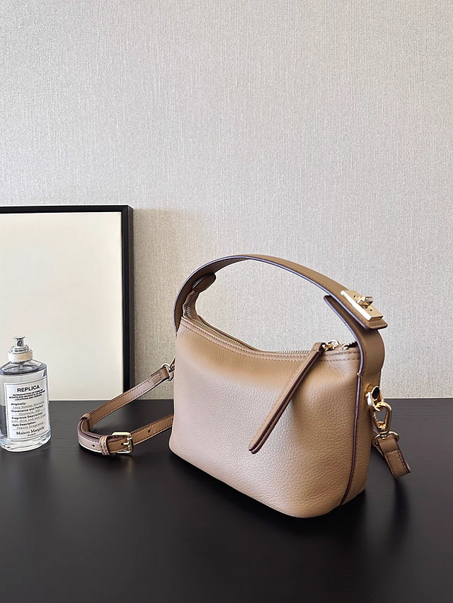 Twist buckle drape toga embossed handle + crossbody bag 1