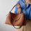 Thumbnail: Caramel single flap toga embossed calf leather two way crossbody bag