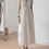 Thumbnail: V neck laced trim side drawstrings cotton ivory sleeveless dress
