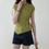 Thumbnail: Avo green side shell buttoned asymmetric strechy tencel poly top