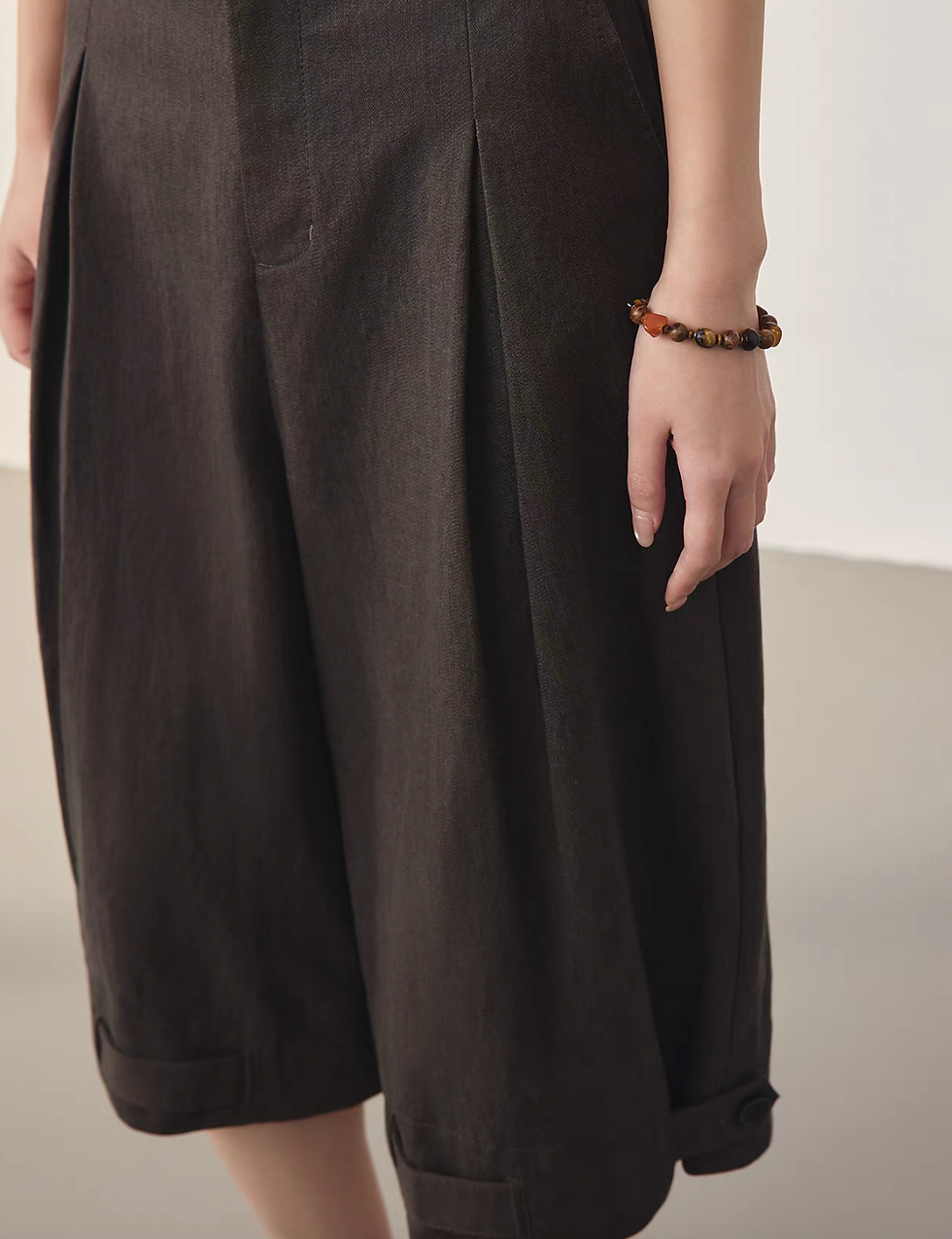 Thumbnail: Mocha brown cotton tencel buttoned strap high waisted pleated shorts