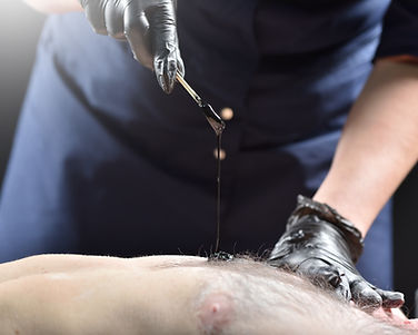Hairy male chest and black wax for depilation. Male waxing.jpg
