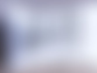 A collection of four handmade 925 sterling silver Serbian Orthodox crosses in various sizes displayed on a white textured pillow