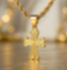 Gold necklace with Hilandarski Krst - Serbian orthodox cross gold pendant on display.