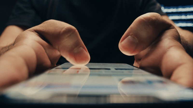 Person scrolling on a smartphone in a social media video by Enjoy New Media
