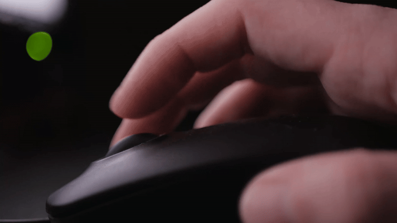 Hand scrolling a mouse in a digital ad project created by Enjoy New Media