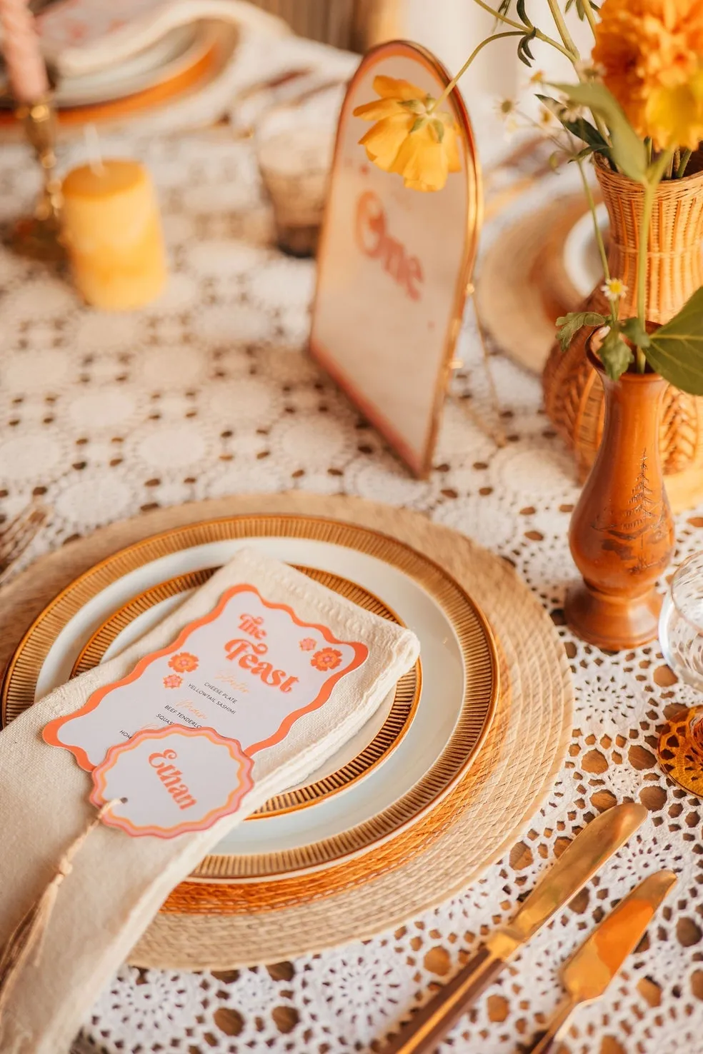Wedding breakfast table decoration, using gold and neutral colors. Supplied and decorated by Disco Dining, an LGBTQ+ wedding supplier part of the Rebel Love Directory